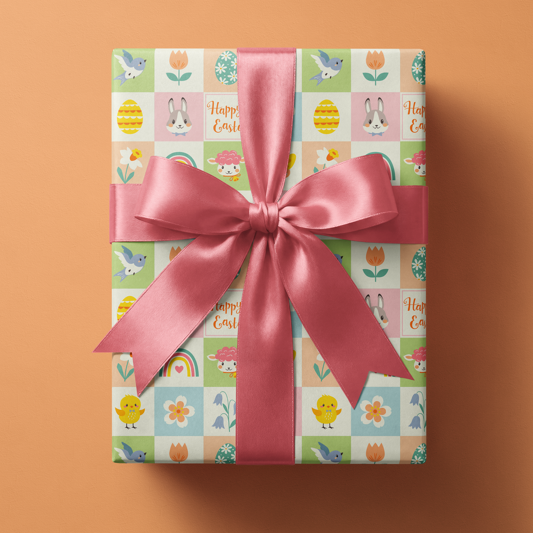 Alt Tag: Easter Wrapping Paper with pastel spring icon patchwork grid, wrapped gift box with pink satin ribbon bow