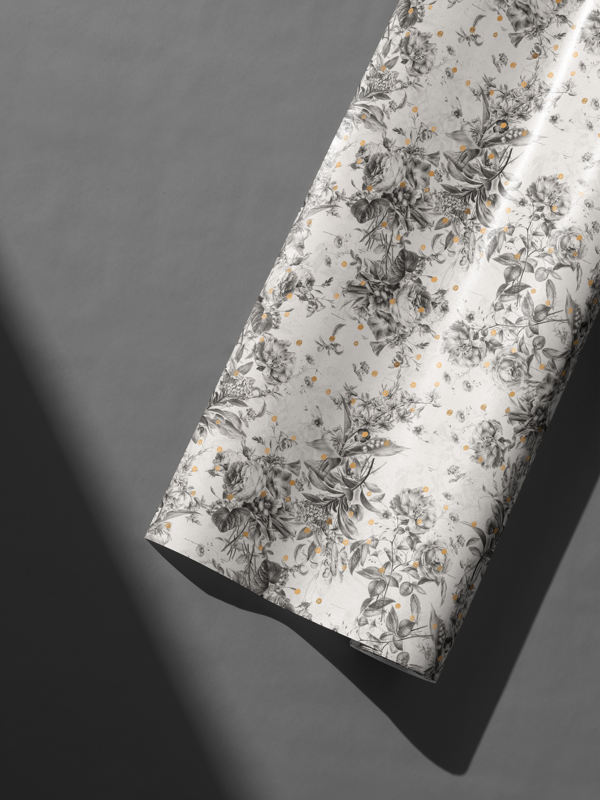 Alt Tag: Black and White Floral Wrapping Paper with botanical sketch florals on ivory and subtle gold speckles, Gilded Botanica roll