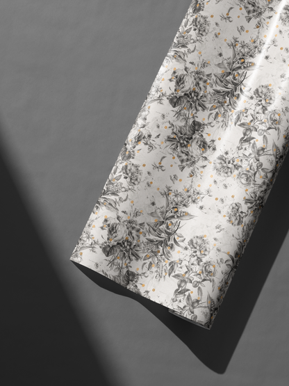 Alt Tag: Black and White Floral Wrapping Paper with botanical sketch florals on ivory and subtle gold speckles, Gilded Botanica roll