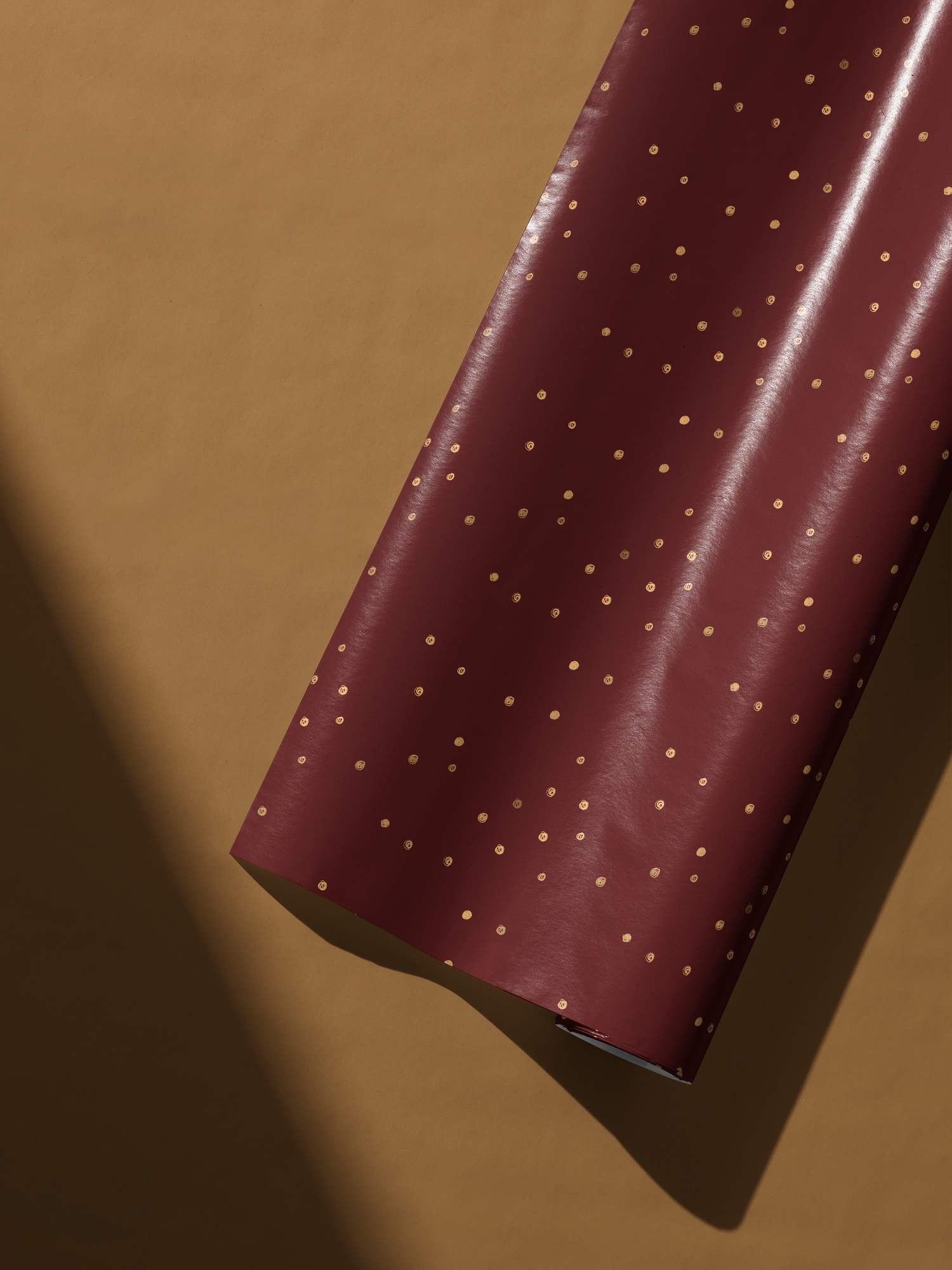 Burgundy and Gold Wrapping Paper roll with subtle gold flecks, luxury gift wrap for elegant presents