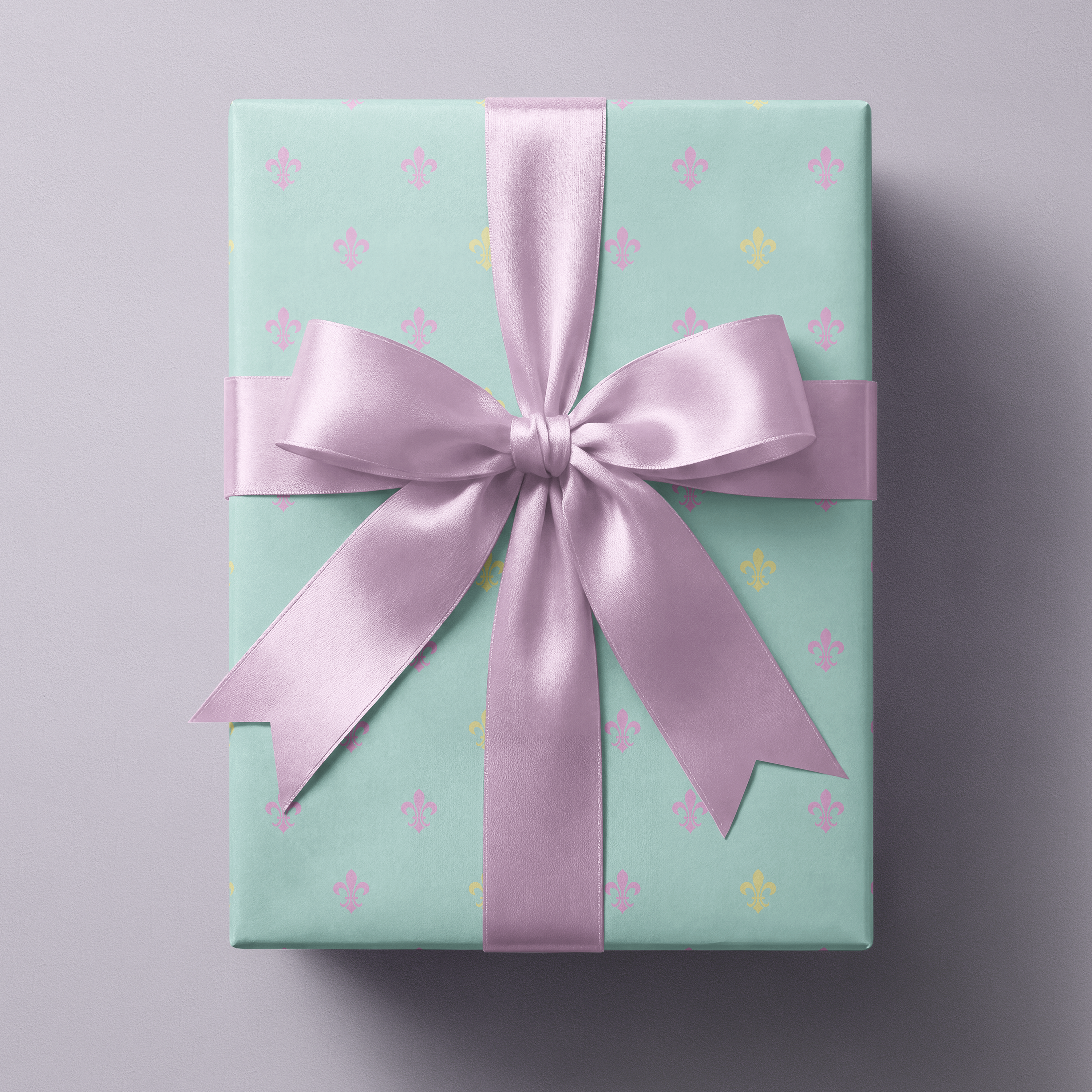 Alt Tag: Fleur de Lis Wrapping Paper on powder blue gift box with pastel fleur-de-lis pattern and lilac satin ribbon bow