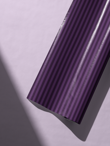 Alt Tag: Purple Striped Wrapping Paper roll with rich violet pinstripes and tonal vertical bands, tailored elegant gift wrap design