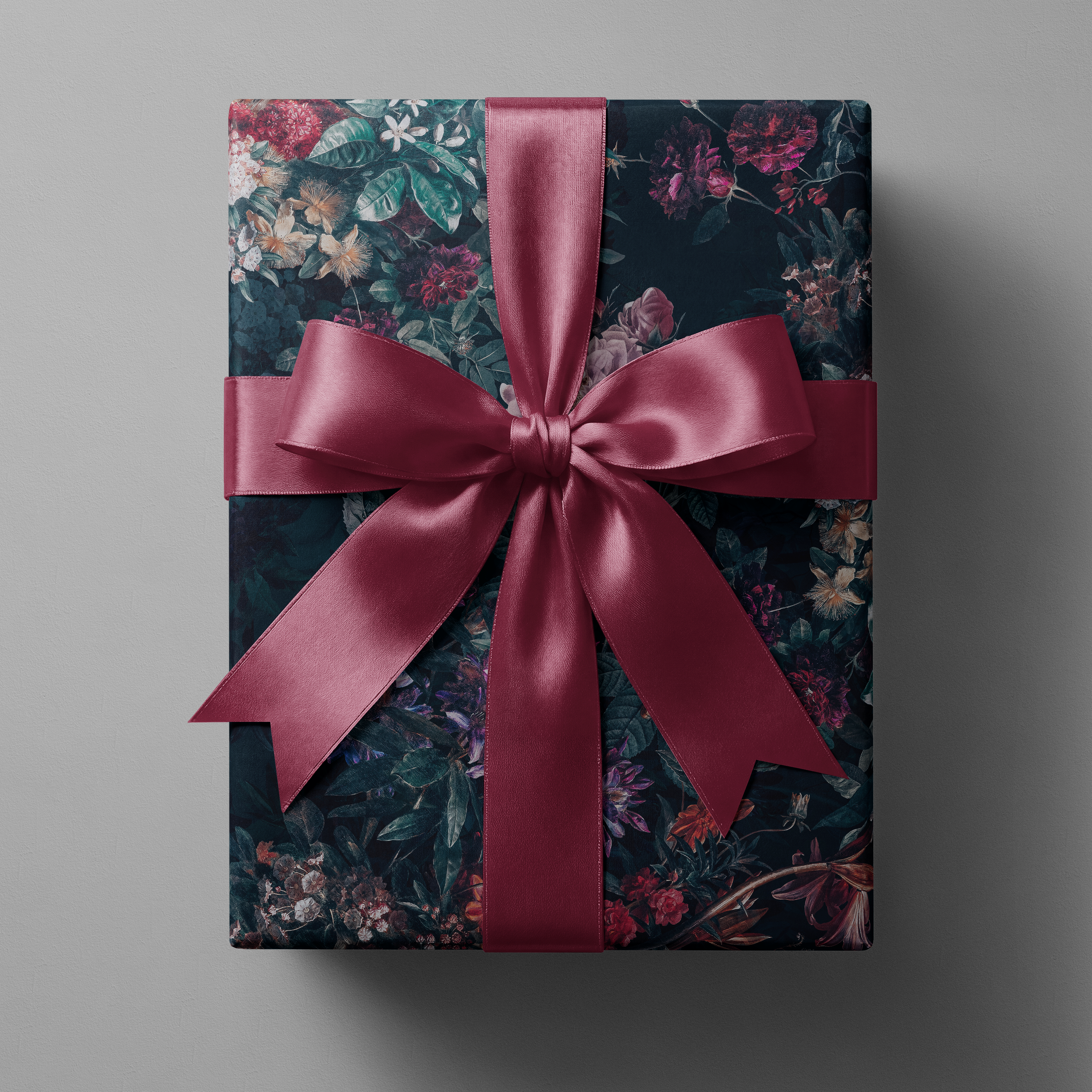 Alt Tag: Moody Floral Christmas Wrapping Paper Velvet Noir gift wrap with jewel-toned florals on midnight background and burgundy satin bow