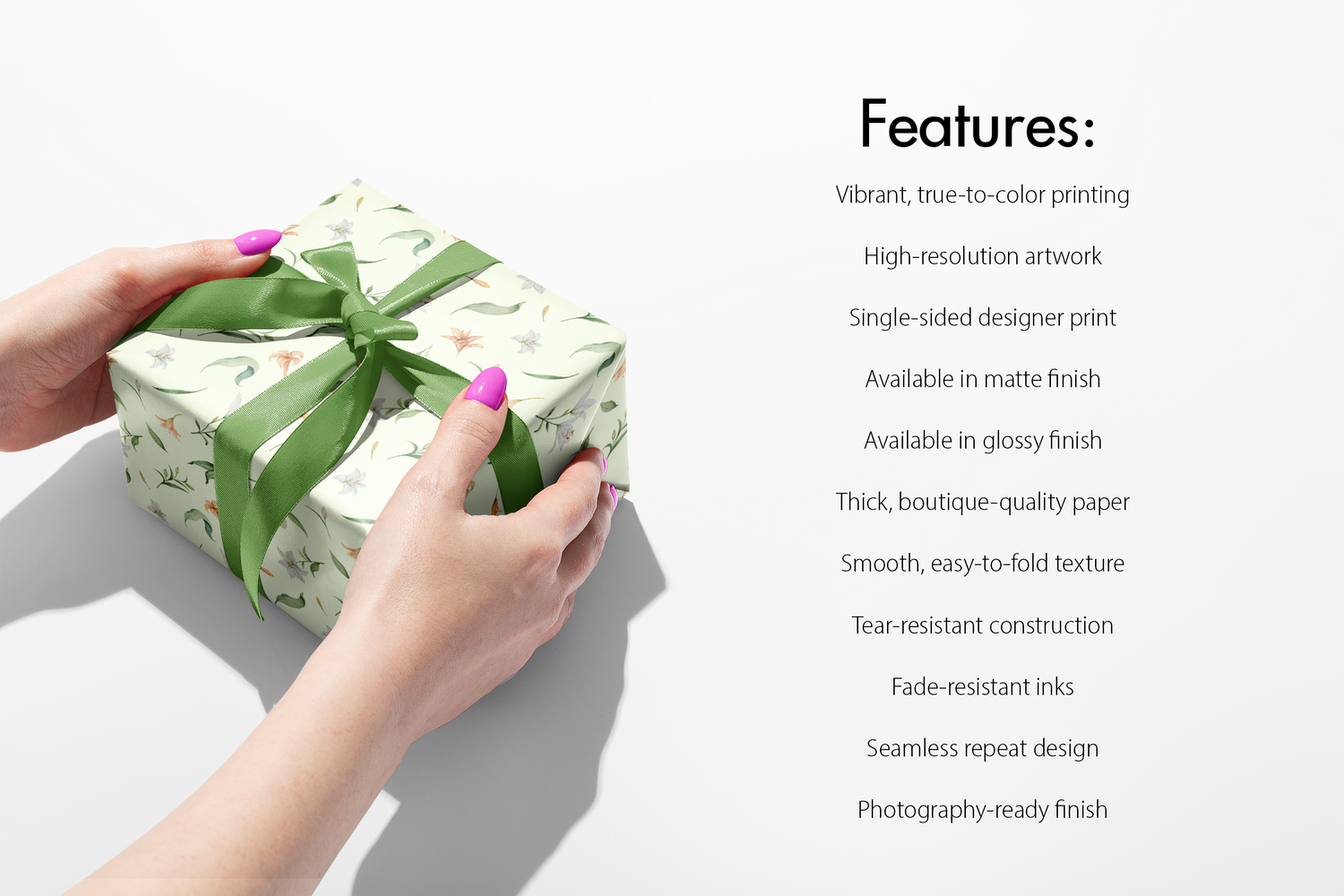 Floral Wrapping Paper Conservatory Bloom on gift box with green ribbon, showcasing sage background with lilies, peach blossoms and greenery