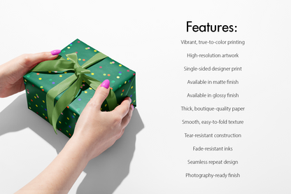 Emerald Jubilee Confetti Wrapping Paper on gift box with jewel-tone dots on emerald green, tied with green ribbon