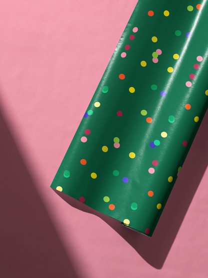Confetti Wrapping Paper Emerald Jubilee on deep emerald green with colorful jewel-tone dots, festive gift wrap roll