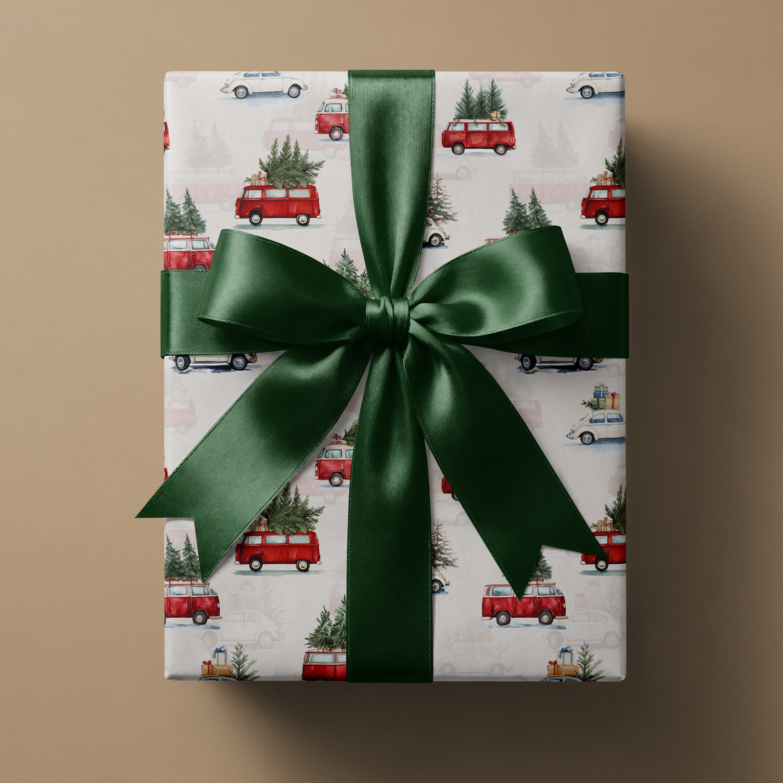 Alt Tag: Vintage Christmas Car Wrapping Paper gift wrap with illustrated red vans and vintage cars carrying trees, wrapped with green ribbon