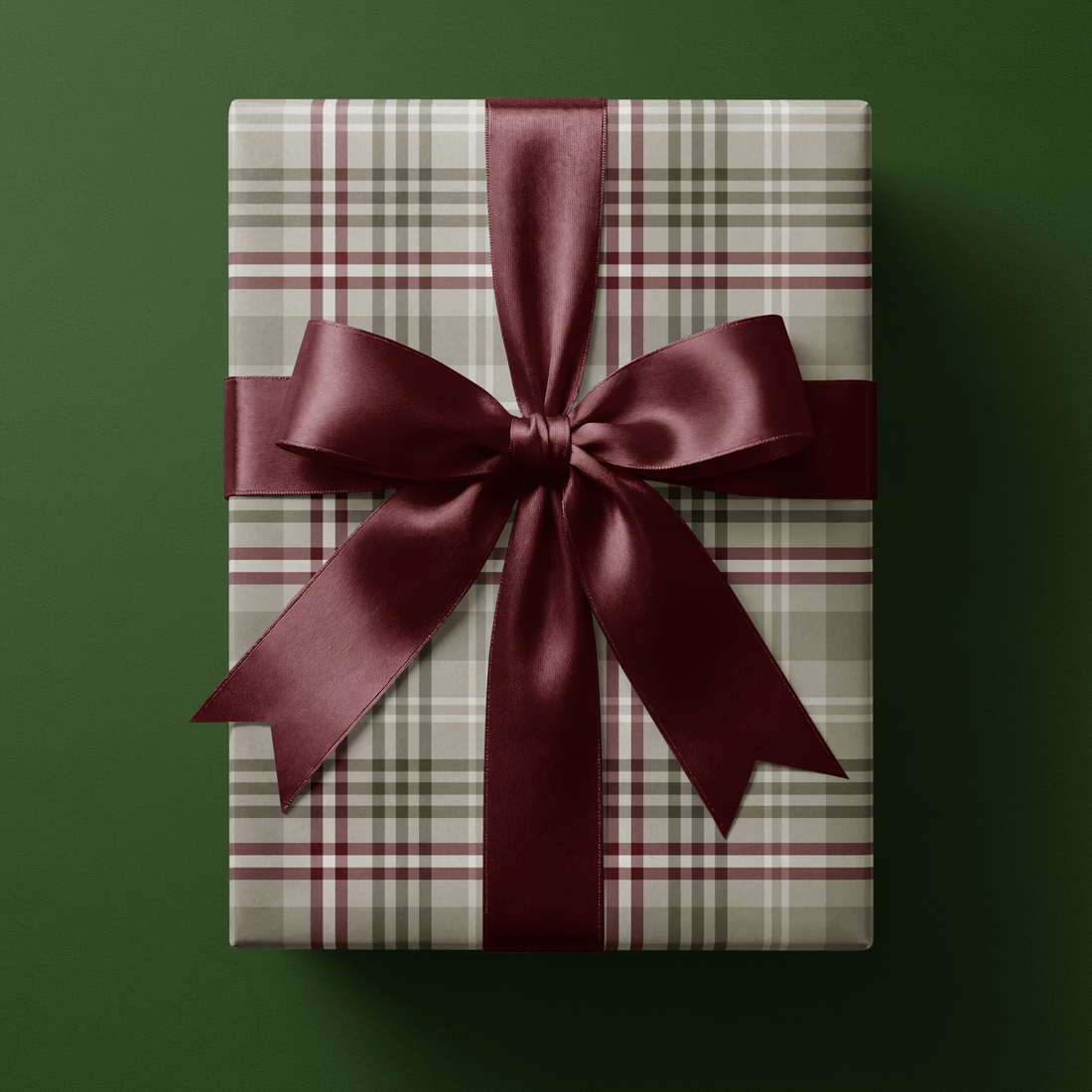 Neutral Christmas wrapping paper in a soft camel and taupe heritage check with burgundy and white overcheck lines.