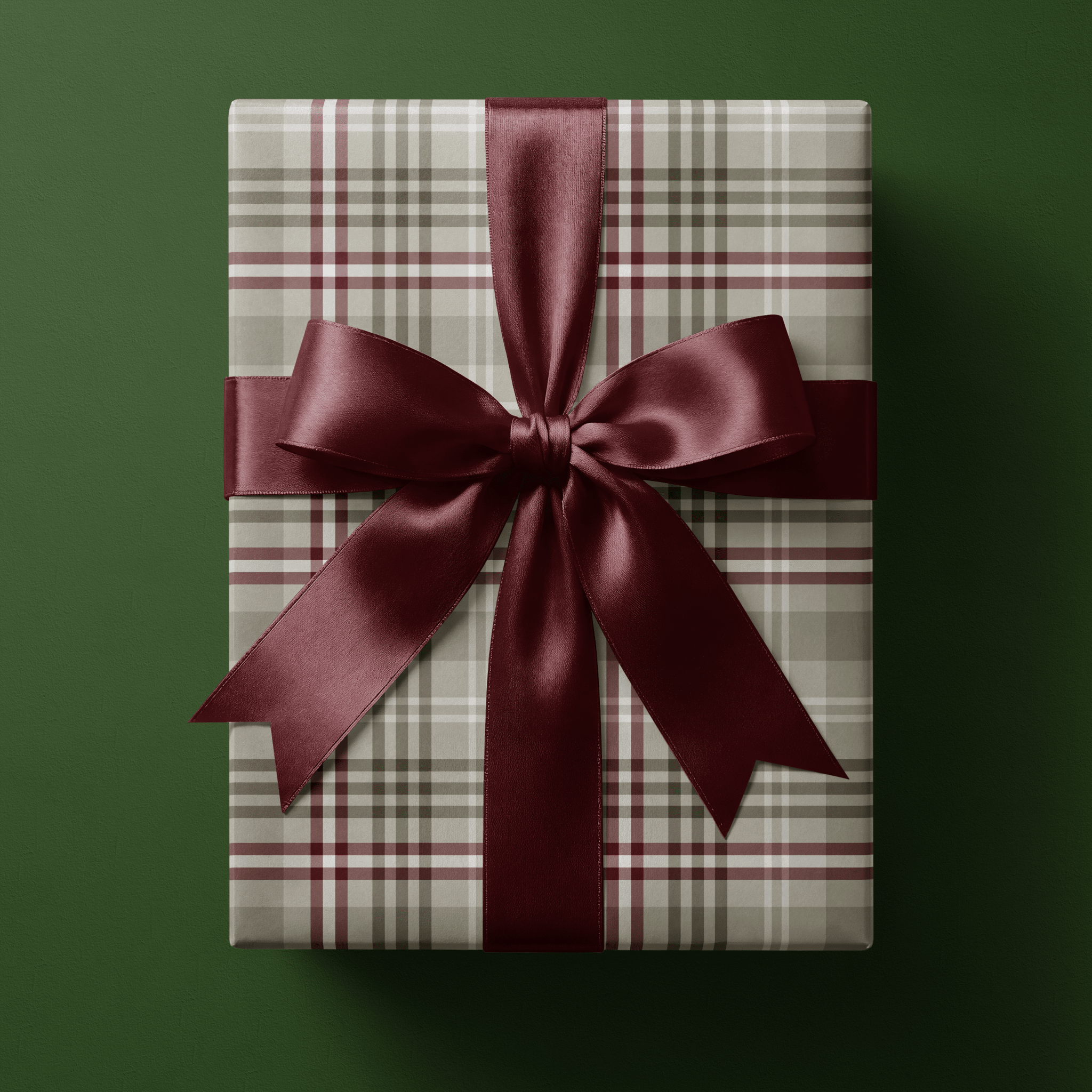 Neutral Christmas wrapping paper in a soft camel and taupe heritage check with burgundy and white overcheck lines.
