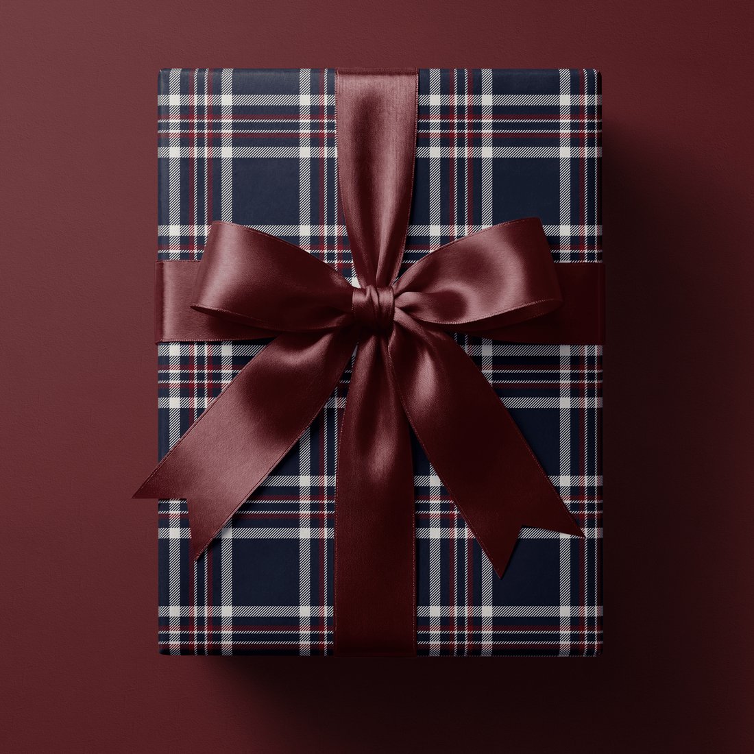 Navy dress tartan Christmas wrapping paper with crisp white and fine red overcheck lines.