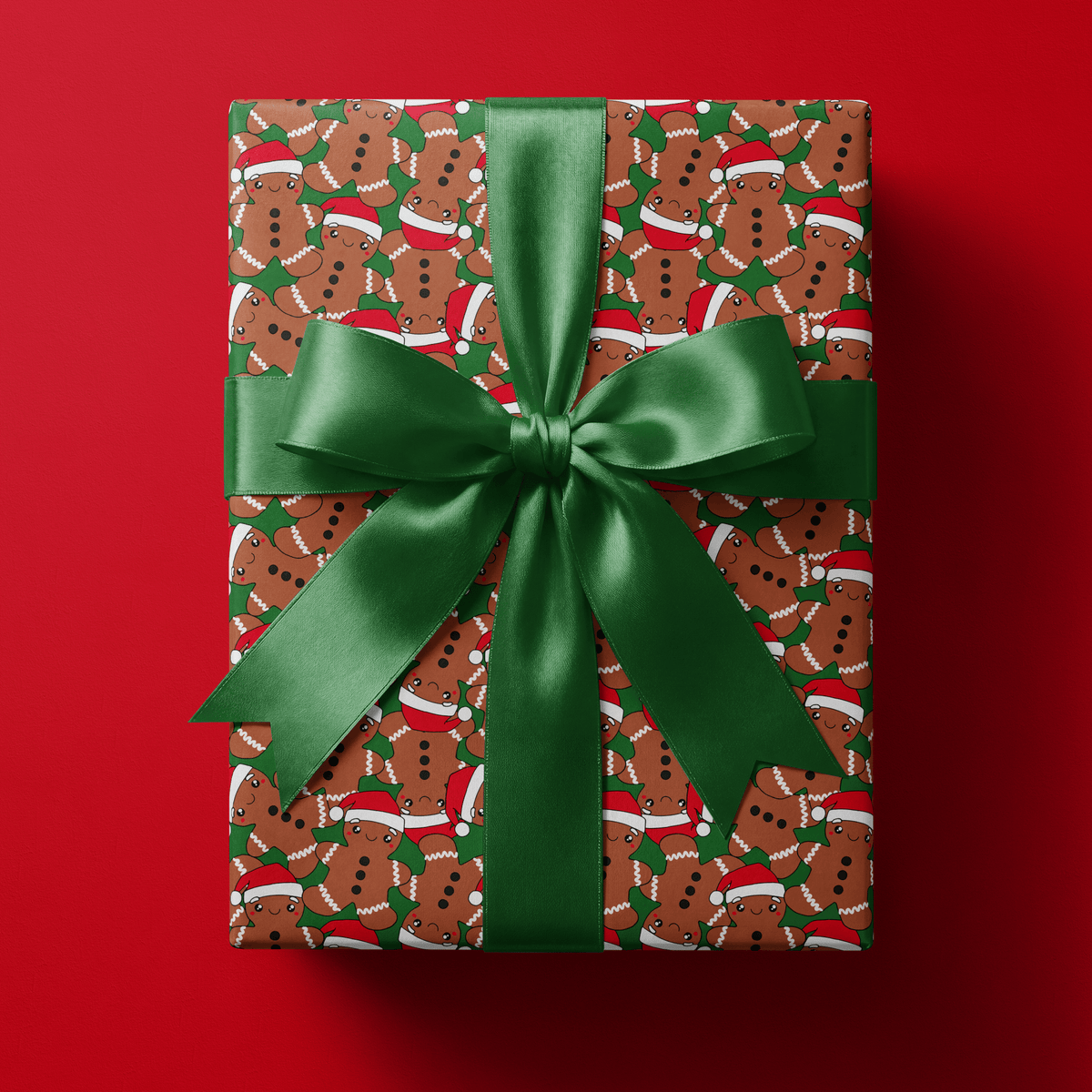 Gingerbread christmas wrapping paper with smiling gingerbread men in Santa hats on forest green.