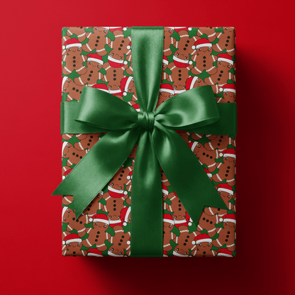 Gingerbread christmas wrapping paper with smiling gingerbread men in Santa hats on forest green.