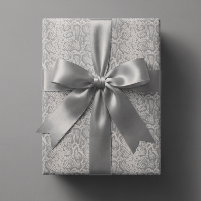 Snakeskin wrapping paper with tonal python texture in soft grey and ivory.