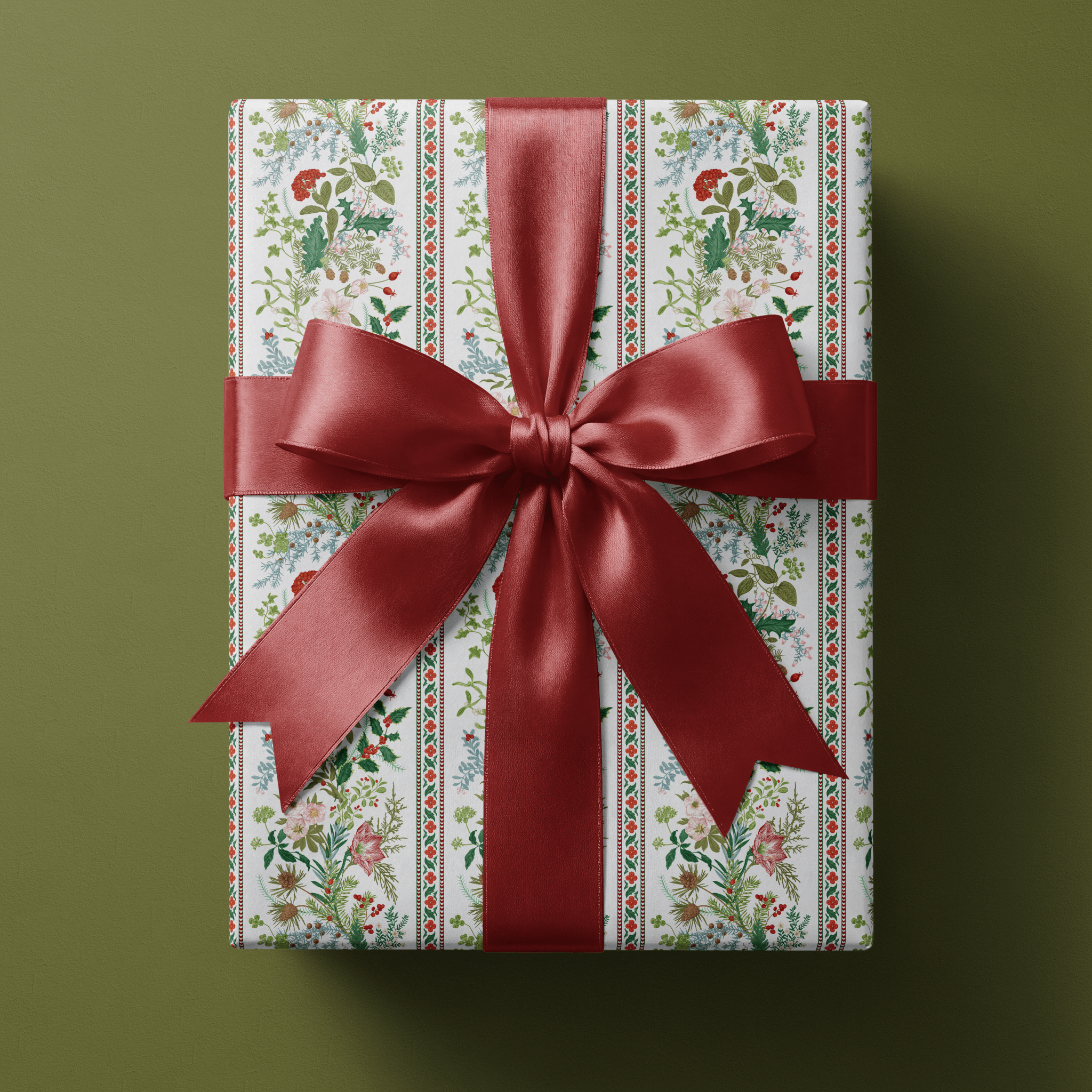 Floral christmas wrapping paper with wildflower bouquets in red and sage on white.