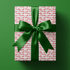 Wrapping paper from Santa in playful red script on white — the easiest way to keep gifts "from Santa" convincing, right down to the paper.