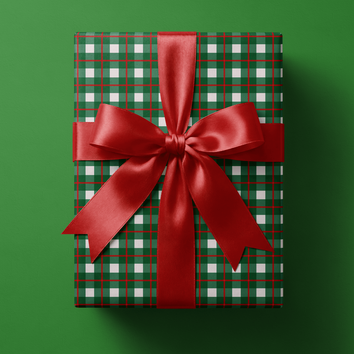 Checkered christmas wrapping paper in a tight forest-green and red grid on white.