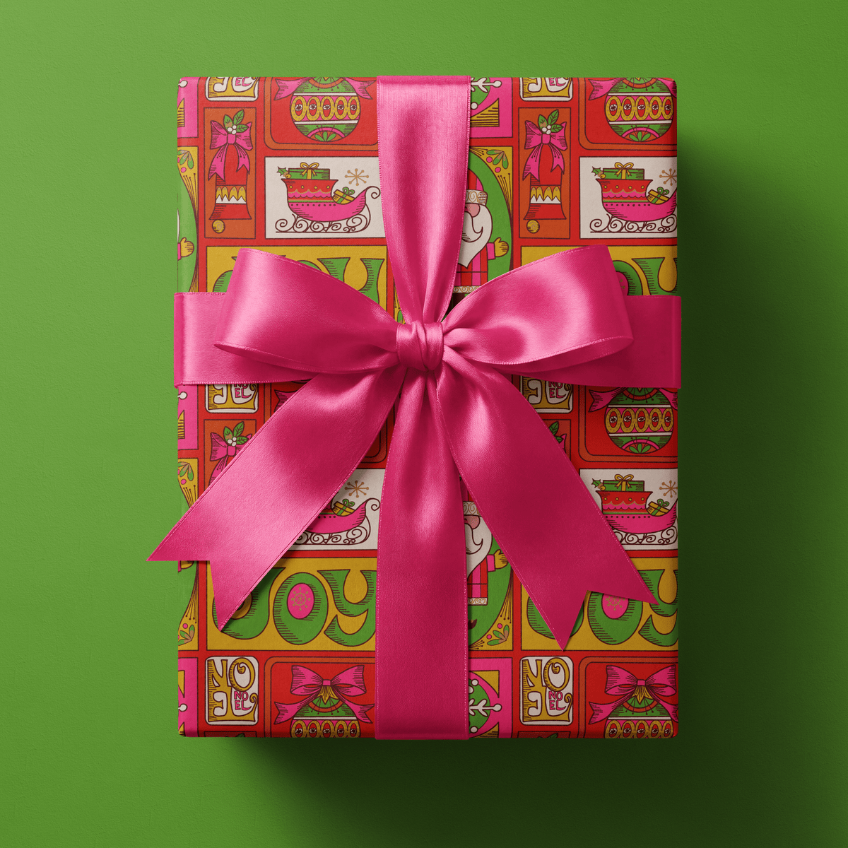 70s christmas wrapping paper patchwork with retro Santas, sleighs, ornaments, and JOY lettering on gold and red.