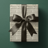 Sheet music gift wrapping paper featuring the vintage carol Jingle, Bells in sepia ink on aged cream paper.
