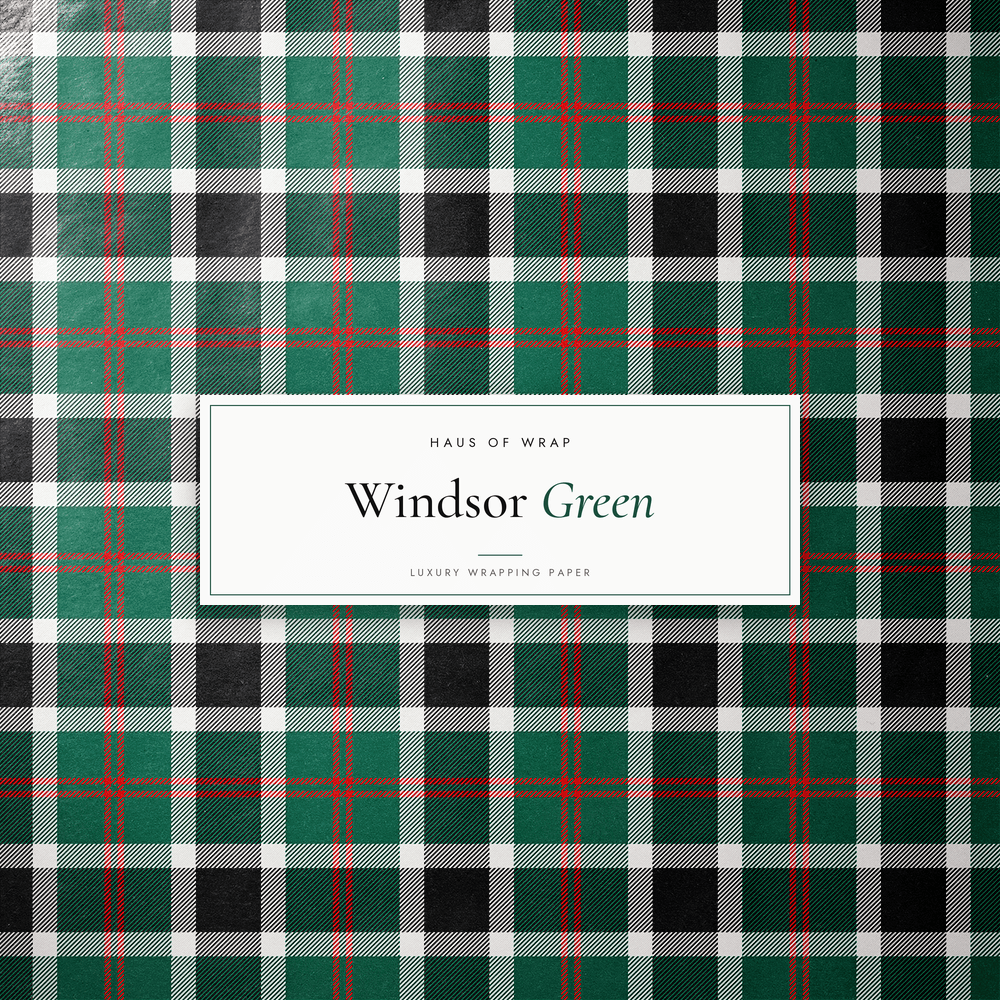 Flat lay of the Deerfield Windsor Green emerald, black, white, and red tartan pattern