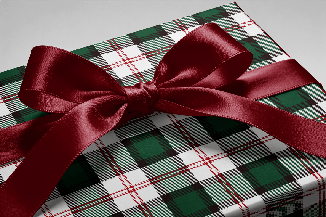 Close-up of the ribbon bow on a gift wrapped in Deerfield tartan wrapping paper