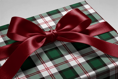 Close-up of the ribbon bow on a gift wrapped in Deerfield tartan wrapping paper