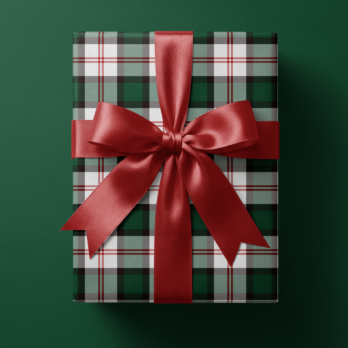 Gift wrapped in Deerfield green plaid wrapping paper, Winter Lodge colorway, tied with a white ribbon bow