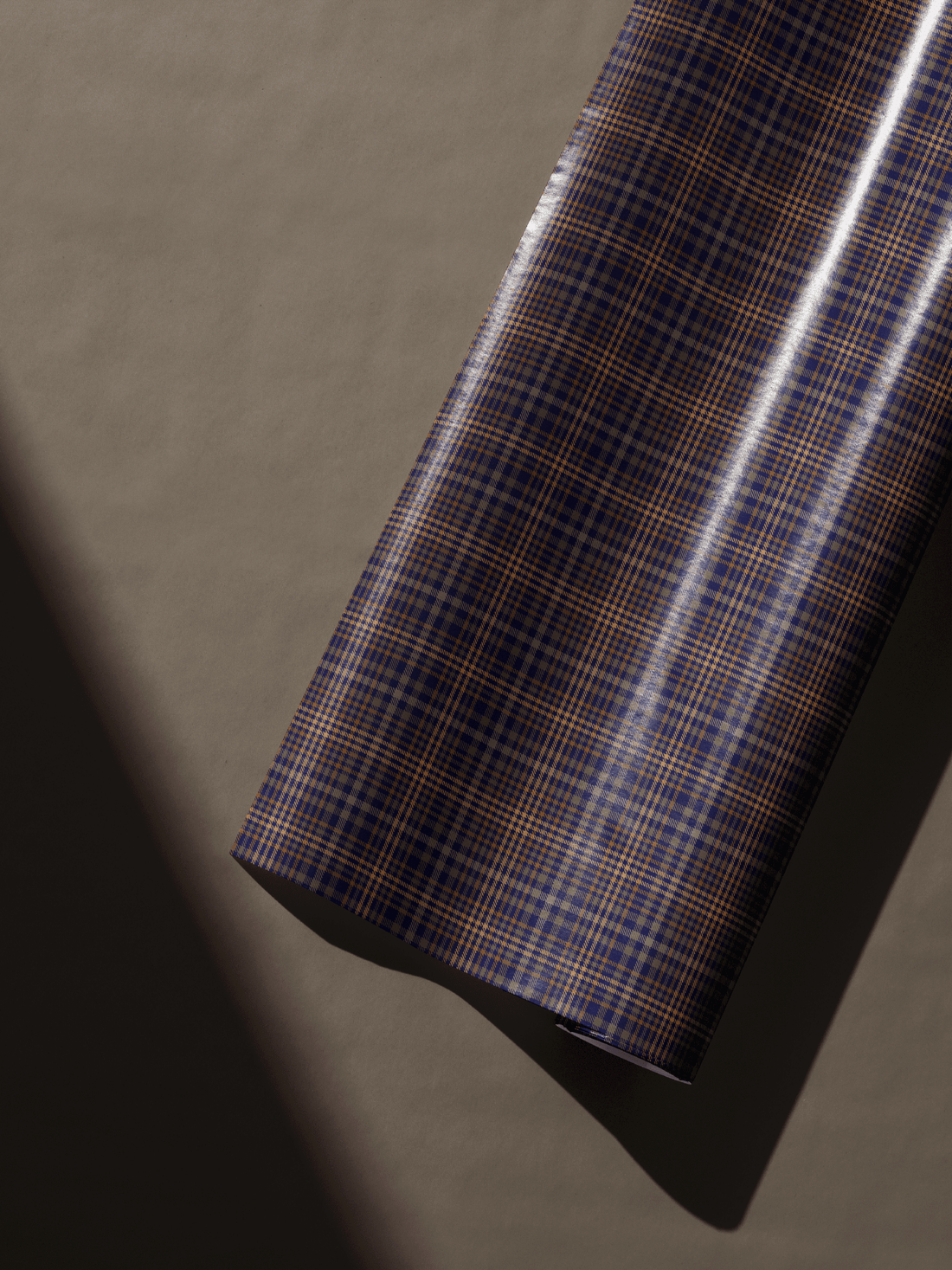 Navy blue and sienna orange tartan gift wrapping paper, perfect for mens birthday and professional gifts.