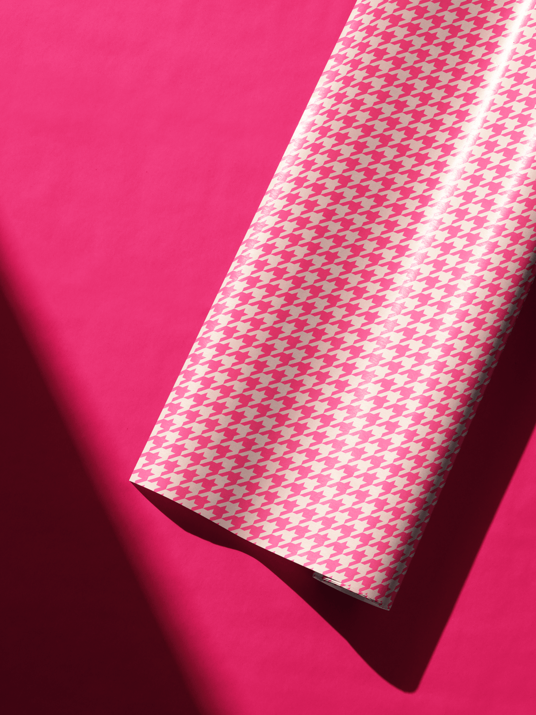 Alt Tag: Pink Houndstooth Barbie Wrapping Paper roll in hot pink and soft petal pink houndstooth pattern