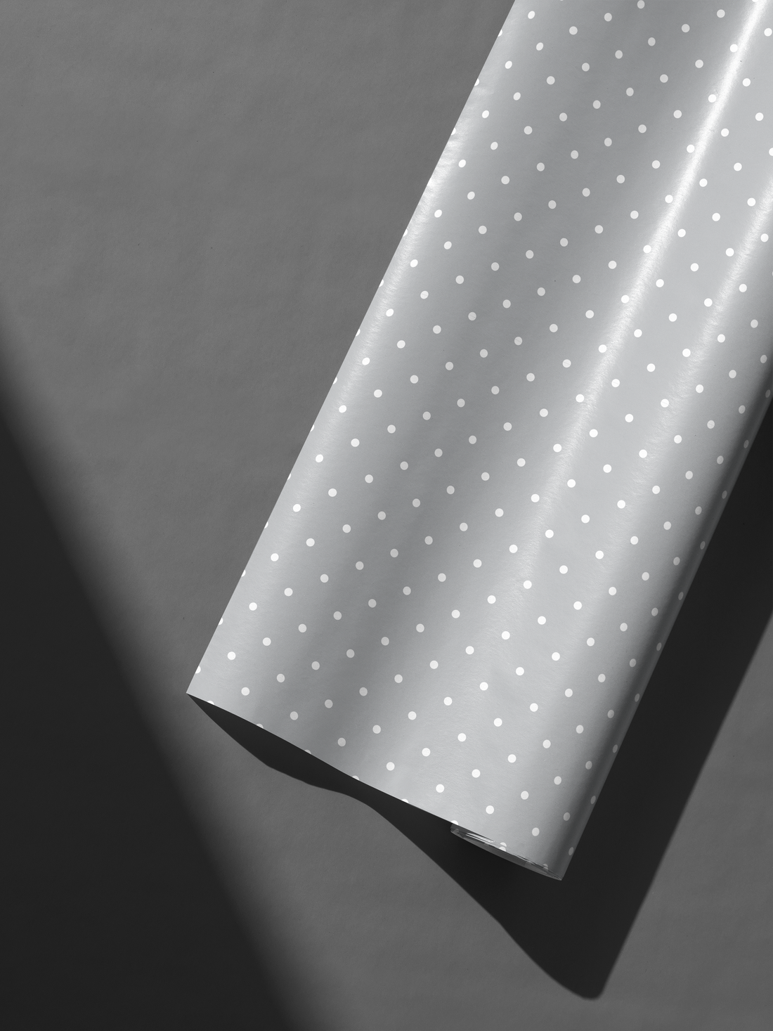 Alt Tag: Elegant Wedding Gift Wrap in soft gray with delicate white polka dots, modern minimalist gift wrapping for weddings