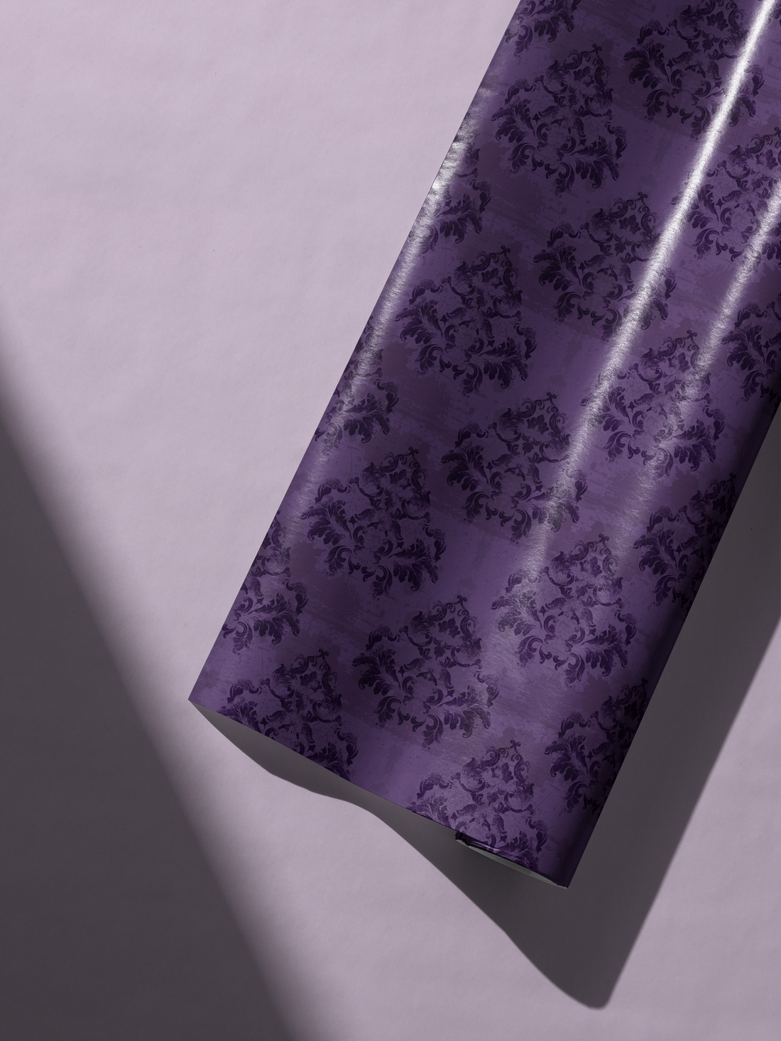 Alt Tag: Luxury Gift Wrap in saturated plum damask with tonal floral pattern, bold dramatic violet gift wrapping paper