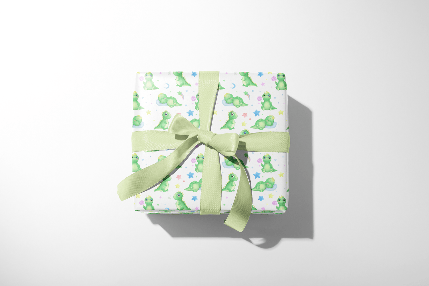 Green Dinosaur Birthday Wrapping Paper with sleepy green dinosaurs, stars and moons, wrapped gift box with green ribbon