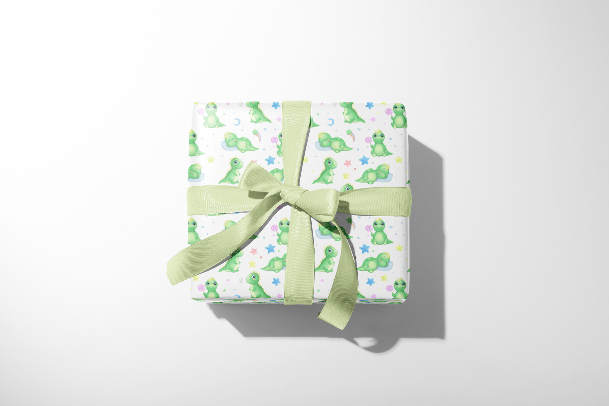 Green Dinosaur Birthday Wrapping Paper with sleepy green dinosaurs, stars and moons, wrapped gift box with green ribbon