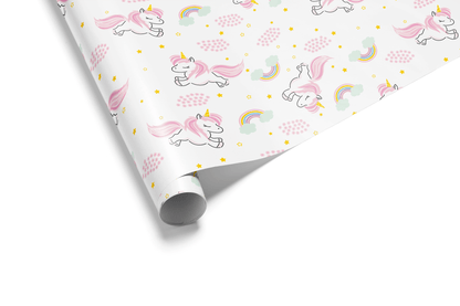Alt Tag: Unicorn Wrapping Paper with pink unicorns, pastel rainbows, and gold stars on white gift wrap roll