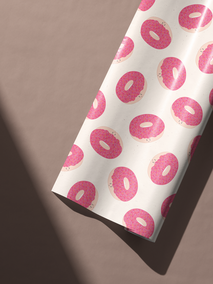 Alt Tag: Donut Wrapping Paper with pink frosted donut and sprinkle pattern on neutral background, Sprinkle Social Affair gift wrap