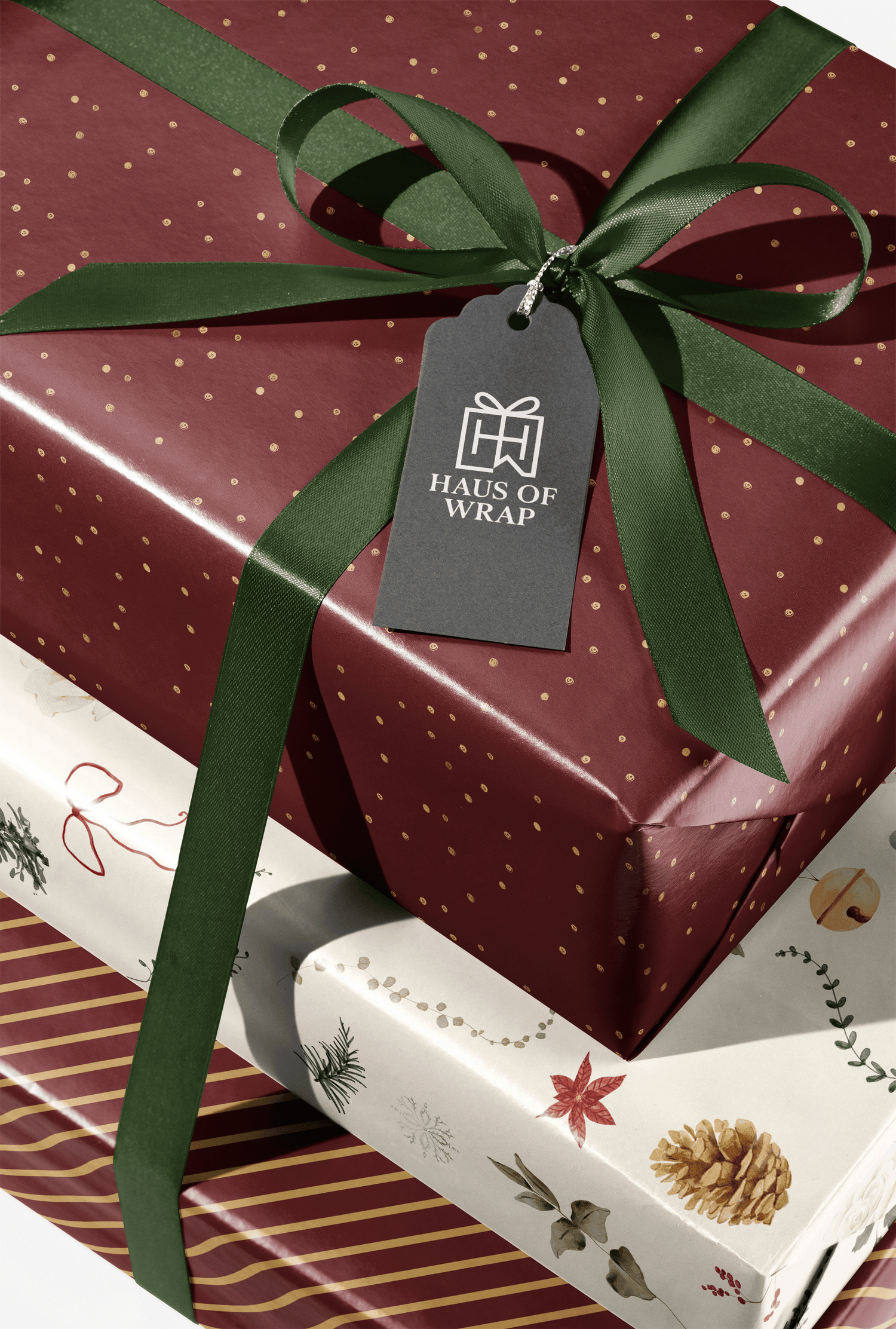 Burgundy and Gold Wrapping Paper gift wrap with gold flecks and green ribbon bow, Golden Reserve luxury present packaging