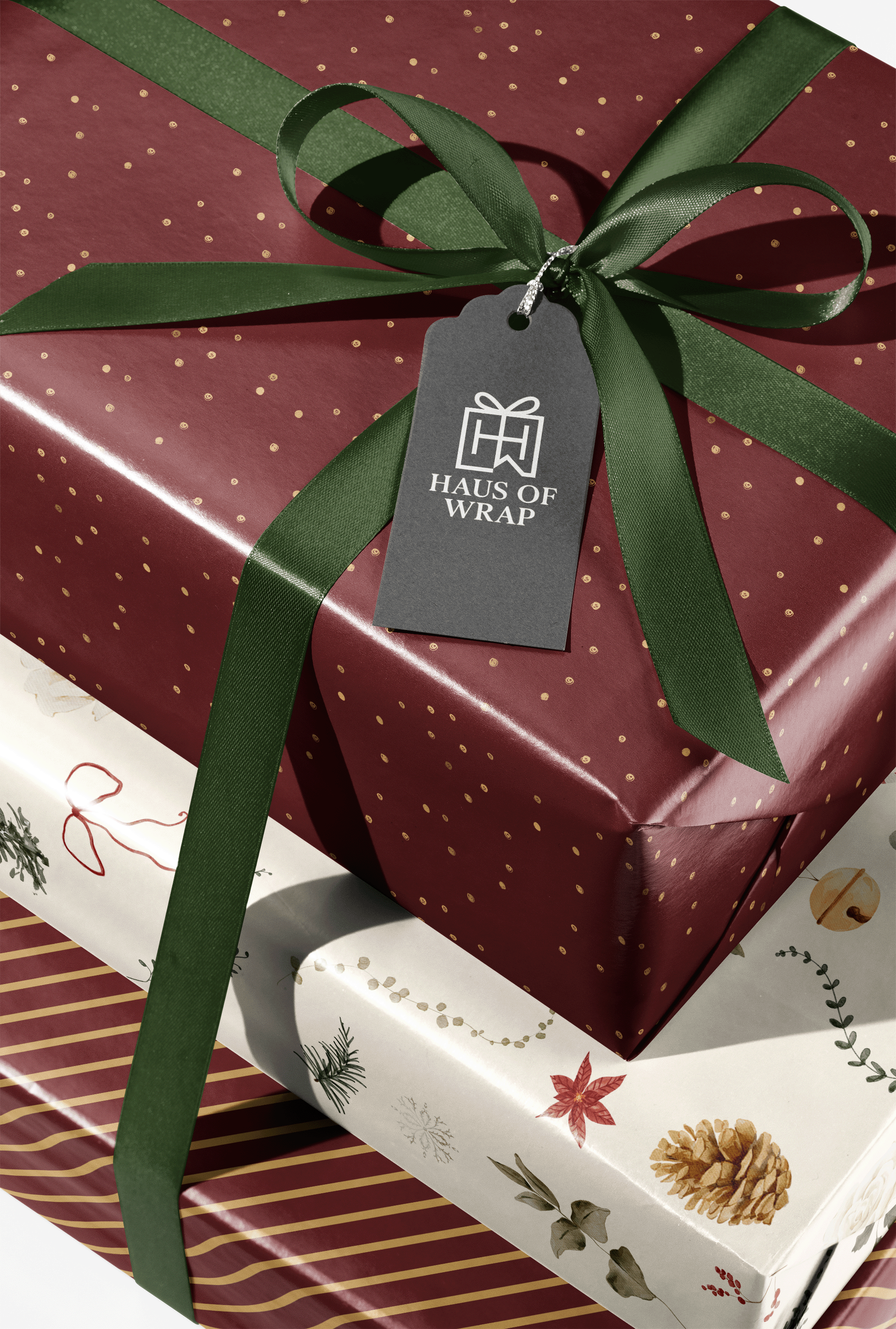 Burgundy and Gold Wrapping Paper gift wrap with gold flecks and green ribbon bow, Golden Reserve luxury present packaging