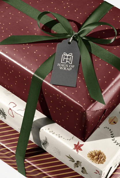Burgundy and Gold Wrapping Paper gift wrap with gold flecks and green ribbon bow, Golden Reserve luxury present packaging