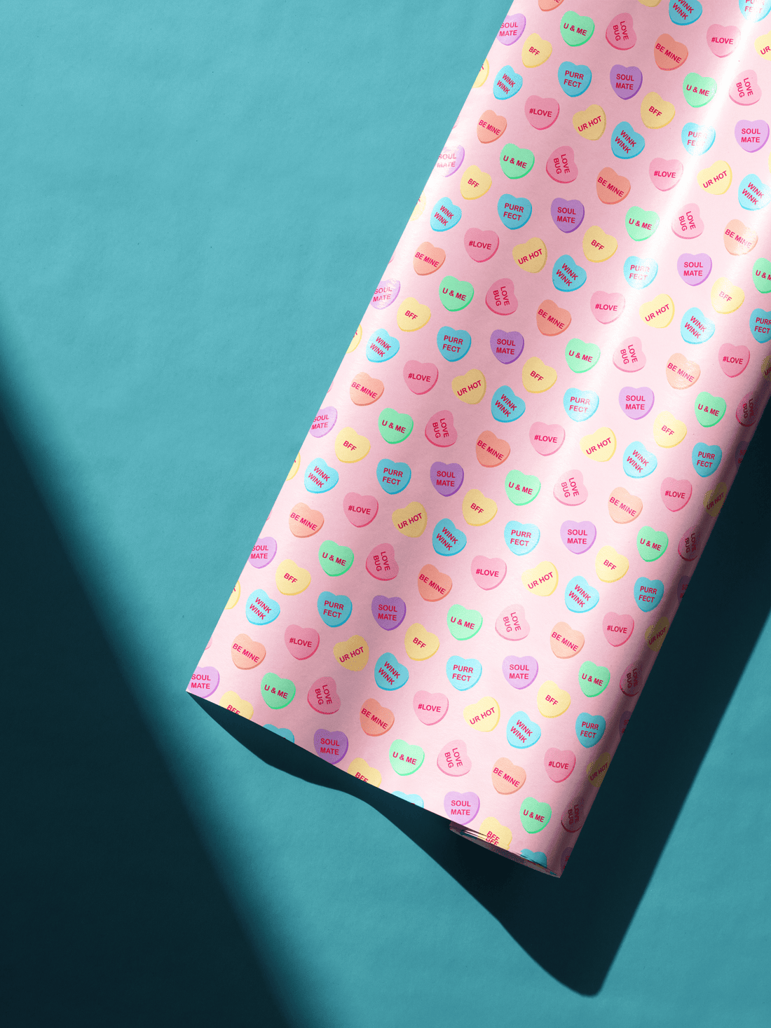 Alt Tag: Pastel Heart Aesthetic Gift Wrapping Paper featuring conversation heart pattern on vibrant pink wrapping sheet