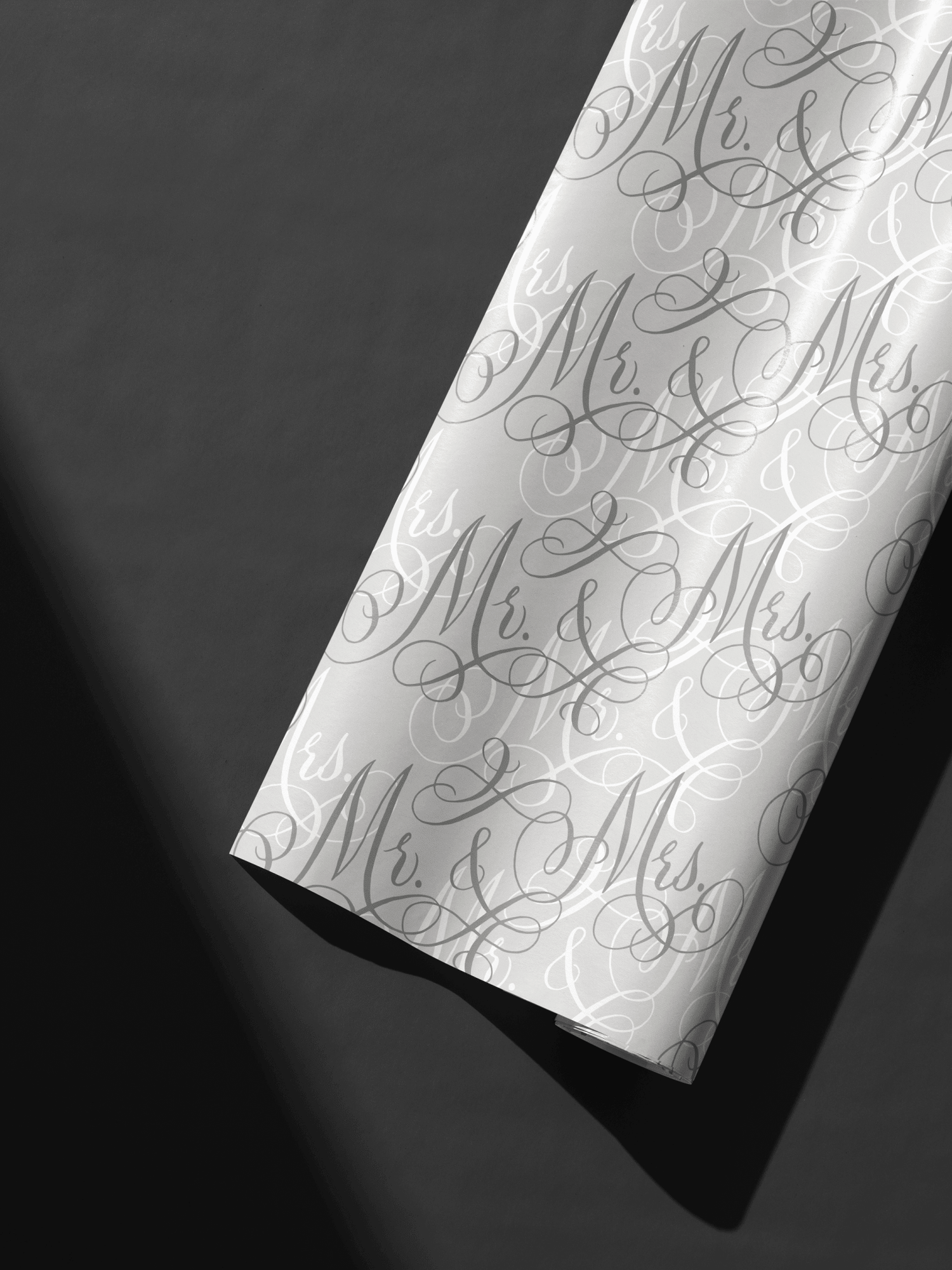 Wedding Wrapping Paper roll with layered Mr. &amp; Mrs. calligraphy script on soft neutral background, luxe wedding gift wrap