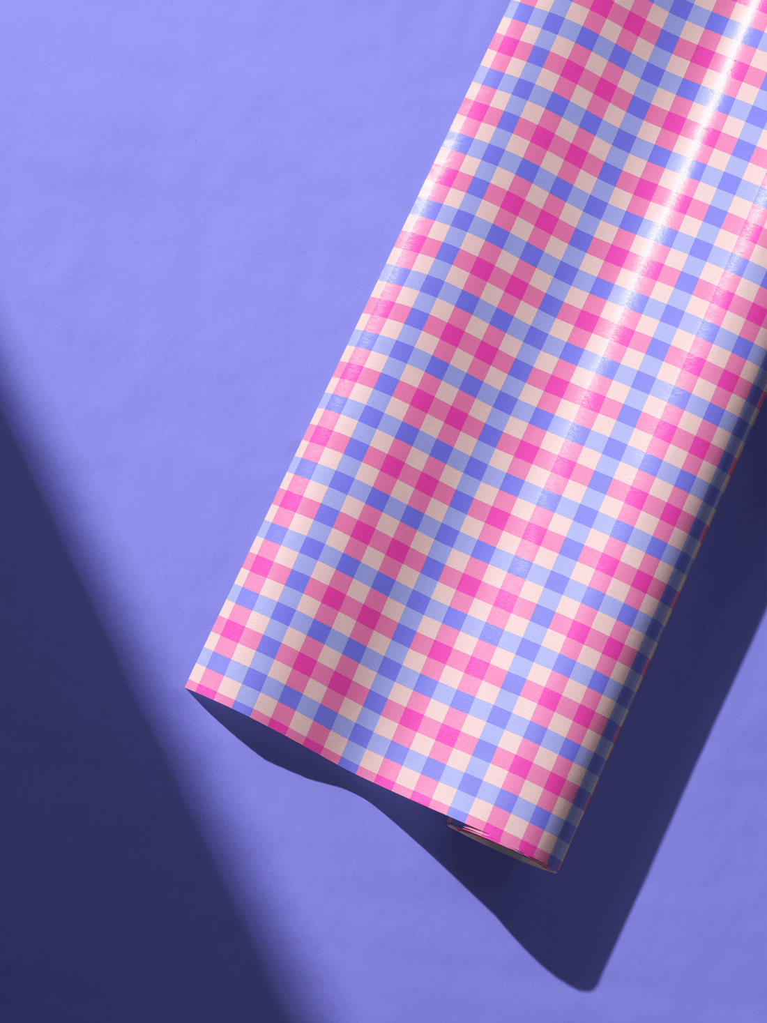 Alt Tag: Pink Gingham Wrapping Paper roll in blush, lavender, and cream checks on purple background, vintage picnic gift wrap