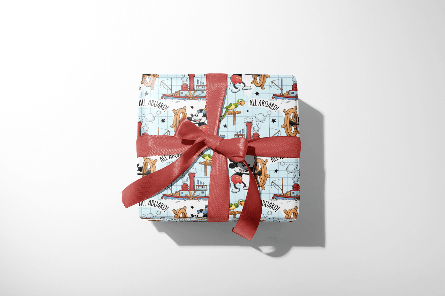 Alt Tag: Whistling Riverboat Nostalgia Voyage steamboat willie wrapping paper for kids on gift box with red ribbon, vintage riverboat print